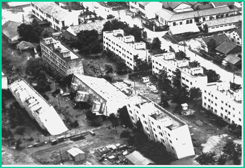 USGS picture of a tilted building from soil liquefaction after a 1964 earthquake in Niigata, Japan